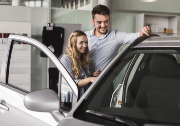 beautiful-couple-looking-car